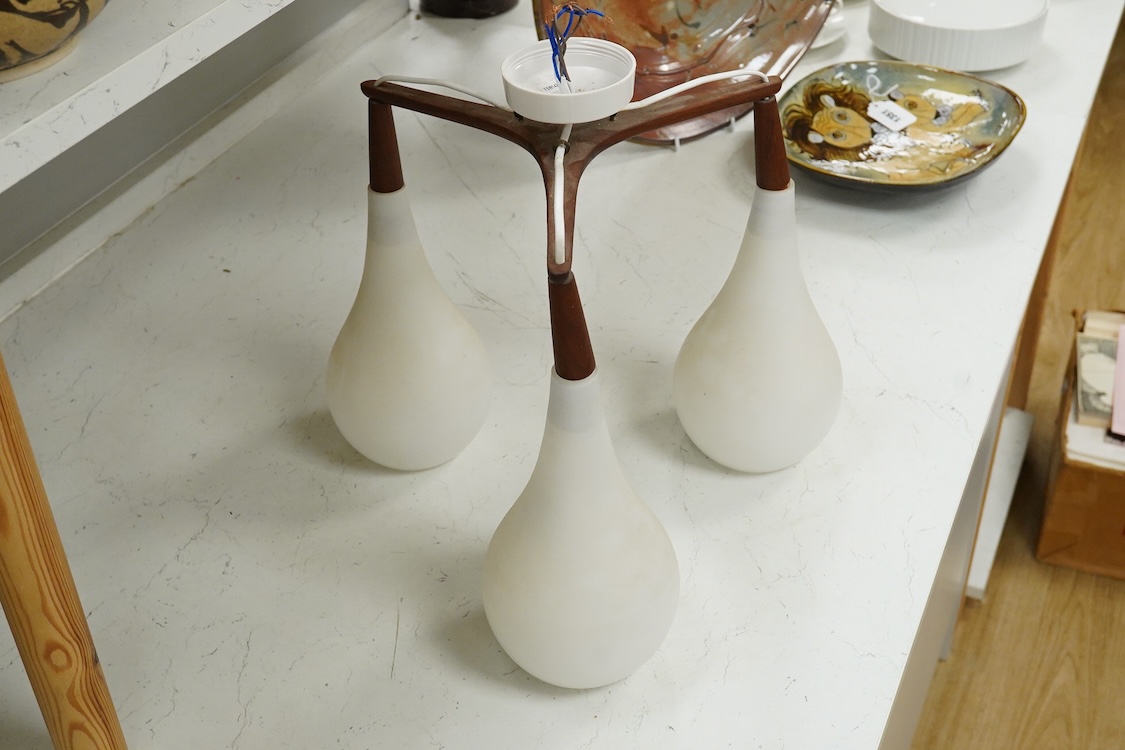 A mid century three light ceiling fitting with opaque glass shades, 38cm high overall